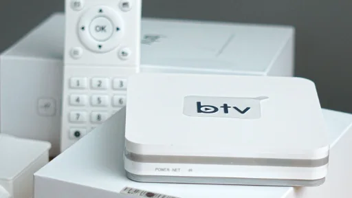 A remote control beside a Smart TV streaming device